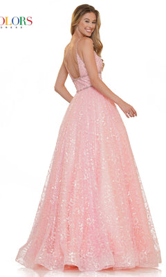 A woman stands and smiles over her shoulder, wearing the Long Glitter Princess Prom Ball Gown 2288—a sleeveless, floor-length pink mesh dress with a deep V-back—against a white background.