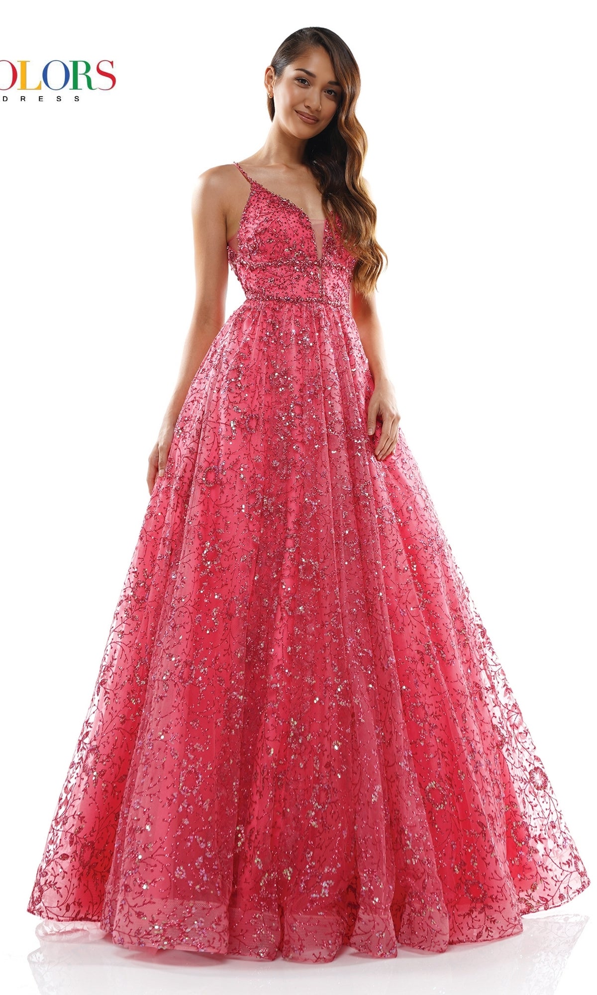 A woman wears the Long Glitter Princess Prom Ball Gown 2288, a bright pink, floor-length mesh gown with sequin embellishments, standing against a white background.