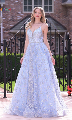 A woman in the Long Glitter Princess Prom Ball Gown 2288 stands outdoors by a brick building and black railing.