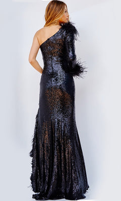 A woman stands with her back to the camera, wearing the Jovani One-Sleeve Feather Long Formal Dress 22895, a full-length sequin gown with feather accents.