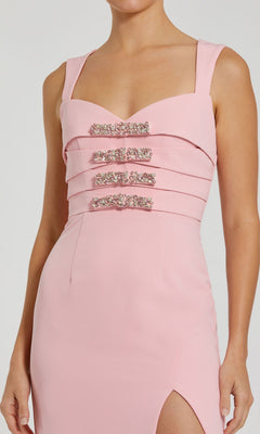 Woman wearing the Mac Duggal 2293 Long Formal Dress, a sleeveless light pink gown with rhinestone-embellished bodice and thigh-high slit.