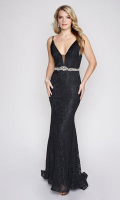 A woman models the Nina Canacci 2299 long formal dress, featuring black lace, a deep V-neckline, and an embellished waistline, standing against a plain light background.