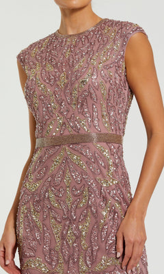 Person wearing a mauve cap-sleeve gown adorned with gold and silver sequin leaf patterns and a matching waistband, reminiscent of the elegance found in the Modest Midi Party Dress: Mac Duggal 23049.