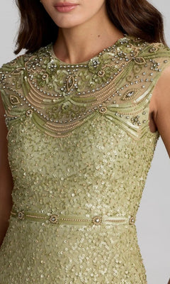 A woman wearing the Mac Duggal 23095 Long Formal Dress, a sleeveless light green sequin gown embellished with beads and floral embroidery on the bodice and featuring a beaded neckline—perfect for formal evening occasions.