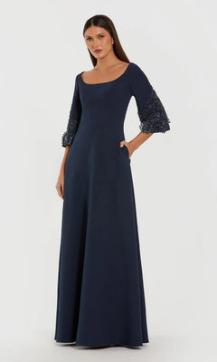 A woman models the Mac Duggal 2311 long formal dress in midnight, featuring three-quarter bell sleeves with lace and bead accents and an elegant a-line silhouette, set against a plain white background.