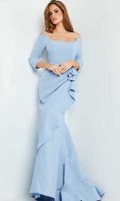 A woman stands against a white background wearing the Jovani Long Formal Dress with Bead Trim 23190—an off-the-shoulder light blue gown featuring ruffle and beaded trim details.