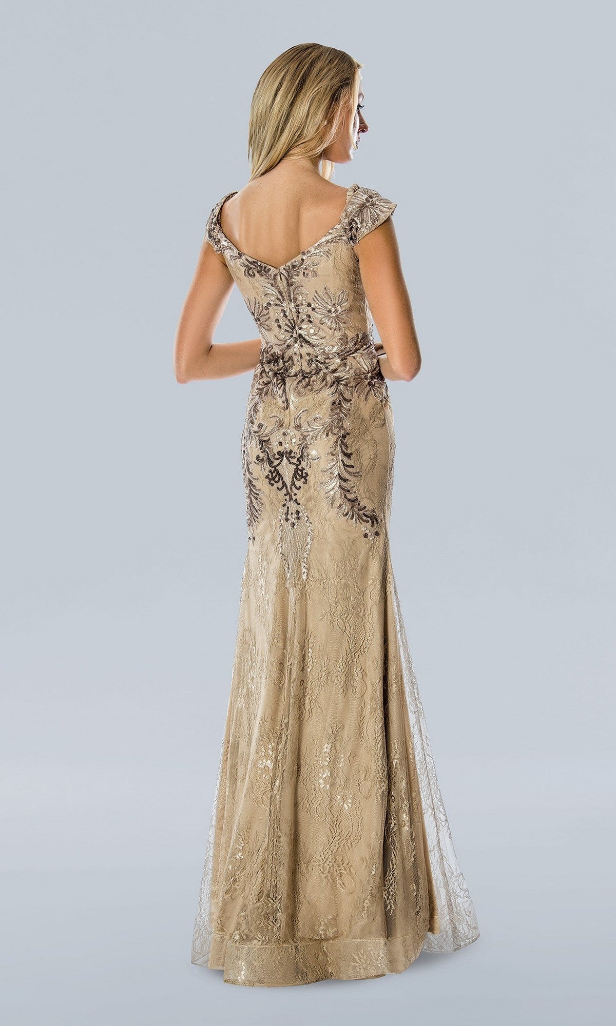 A woman faces away, wearing the Stella Couture 23357—a taupe long formal dress with cap sleeves and intricate sequin lace detail, creating a stunning evening look.
