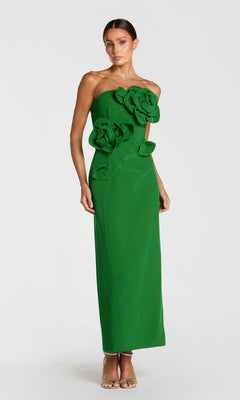 A woman stands against a plain white background wearing the Long Formal Dress: Mac Duggal 2361 in Spring Green, a strapless, floor-length gown adorned with large 3D floral appliqués.