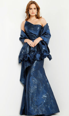Woman wears the Jovani 23624 Long Formal Dress, featuring an off-shoulder metallic print, structured ruffled bodice, and fitted mermaid silhouette, against a plain white background.