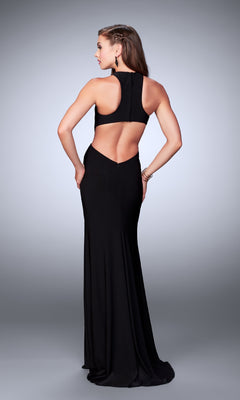 A woman models the Long Prom Dress: La Femme 23791, featuring a unique bodice and open back, as she stands with her back to the camera against a plain background.