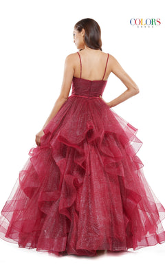 A woman faces away, wearing the Layered Long Tulle Prom Ball Gown 2381—a sparkly deep red formal dress with thin straps, layered ruffles, and an a-line tulle skirt. The background is plain white with a "COLORS" logo in the corner.