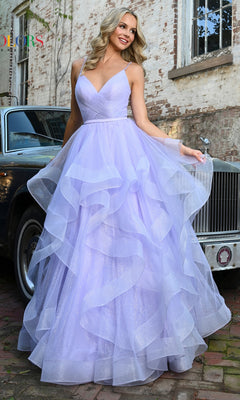 A woman in the Layered Long Tulle Prom Ball Gown 2381, featuring a ruffled a-line tulle skirt, poses outdoors before a vintage car and brick building.