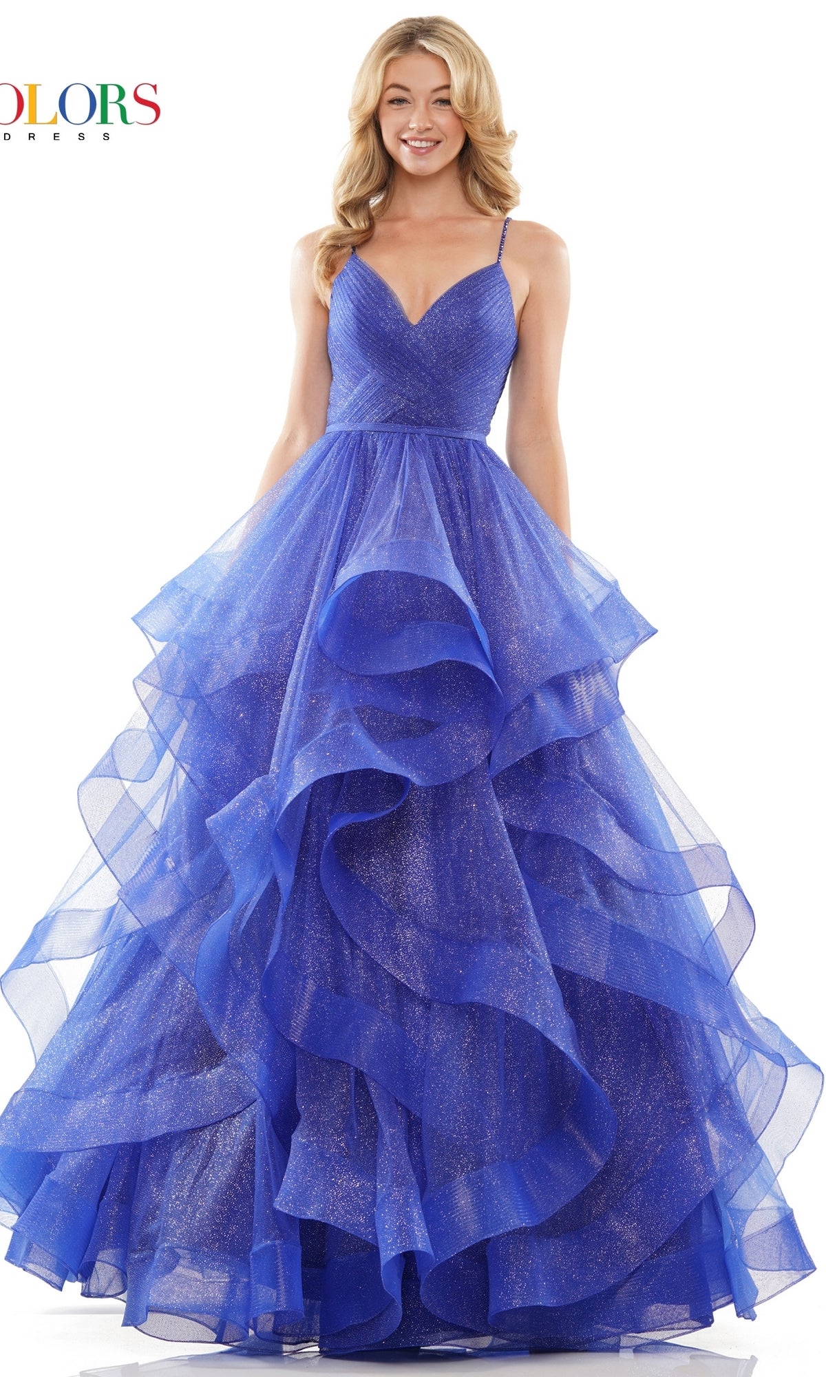A woman wearing the Layered Long Tulle Prom Ball Gown 2381, featuring a blue sparkly design, spaghetti straps, and an a-line tulle skirt, smiles at the camera.