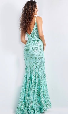 Woman with long curly hair poses with her back to the camera wearing the Jovani V-Back Long Sequin-Print Prom Dress 23839, a floor-length, fitted, sleeveless mint green gown.