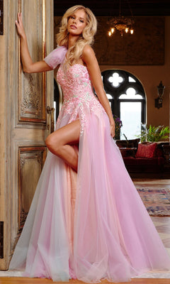 A woman stands in an ornate room wearing Jovani 23951, a light pink, one-shoulder long prom dress with floral details and a high slit.