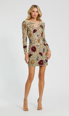 A woman wearing the Short Party Dress: Mac Duggal 24006 in Nude Multi, a long sleeve mini dress embellished with colorful beaded floral embroidery, stands against a plain white background.