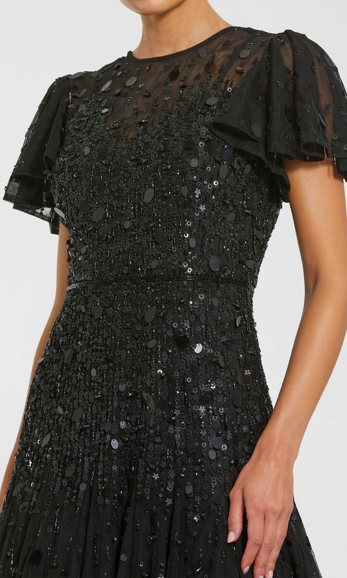 A woman wearing the Mac Duggal 24018: a brown, tea-length party dress designed by Mac Duggal.