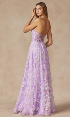 A woman models the Juliet 2403 long prom dress featuring a strapless lavender lace corset bodice and sheer lace back, as she looks over her shoulder against a neutral background.