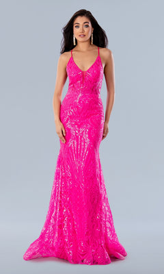 A woman stands against a light gray background wearing the Sheer-Waist Long Sequin-Print Prom Dress 24115, a bright pink, floor-length gown with a fitted sequin bodice, flared skirt, and strappy back design.