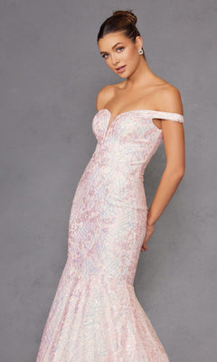 A woman poses elegantly against a grey background wearing the Off-the-Shoulder Sequin Mermaid Prom Dress 2412 in light pink, featuring iridescent sequin patterns.