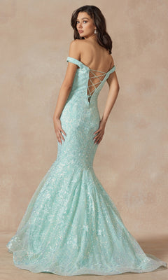 A woman stands against a neutral background wearing the Off-the-Shoulder Sequin Mermaid Prom Dress 2412 in light blue, featuring sequin details, a lace-up back, and a floor-length silhouette.