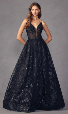 A woman stands against a neutral gray background wearing the Sheer-Corset Glitter-Print Long Prom Dress 2413—a sleeveless, floor-length black A-line gown with a deep V neckline and shimmering floral patterns.