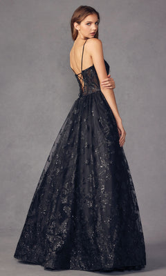 A woman in the Sheer-Corset Glitter-Print Long Prom Dress 2413, featuring a lace-up back and subtle glitter patterns, stands against a gray background, looking over her shoulder.