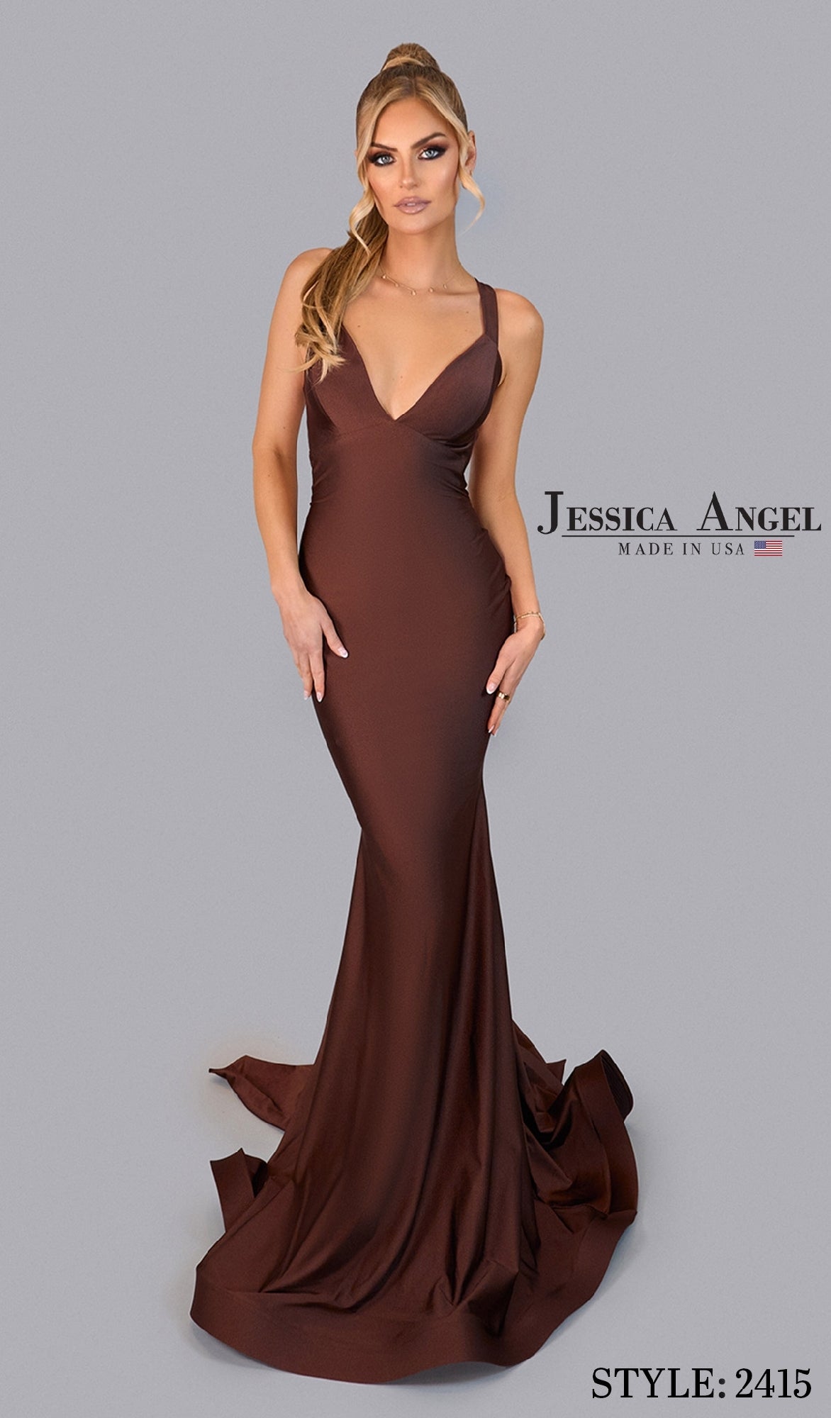 A woman models the fitted, floor-length Backless Prom Dress with Train: Jessica Angel 2415 in brown, featuring straps and a subtle train, against a plain gray backdrop. Stylish choice for prom. Text: “Jessica Angel” and “Style: 2415.”.