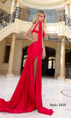 A woman in the Jessica Angel 2418 Shoulder-Drape Long Prom Dress stands gracefully in an elegant, marble-floored room with ornate railings and columns.
