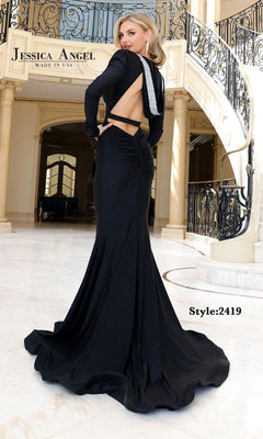 A woman wearing the Jessica Angel 2419 Long Sleeve Hoodie Prom Dress poses on a marble floor by a staircase; "Style: 2419" appears on the image.
