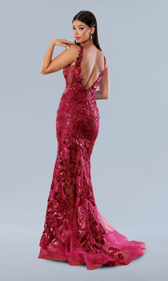 A woman poses in the Stella Couture Long Prom Dress 24244, a floor-length, sleeveless deep red sequin gown with floral detailing and a low-cut back, set against a plain light gray background.