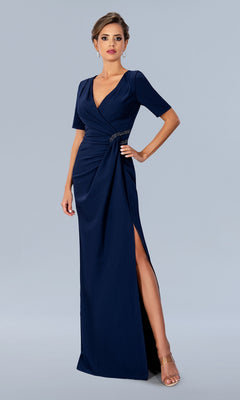 A navy, floor-length Stella Couture 24317 V-neck evening gown with short sleeves, a wrapped bodice, and a high side slit.