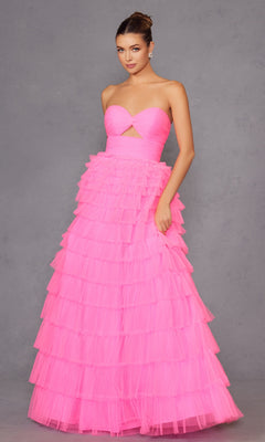 A woman wears the Long Prom Dress JT2456H by Juliet, a strapless ball gown with an empire waist and ruffle tulle tiered skirt, standing against a plain gray background.