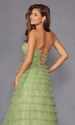 A woman in the Long Prom Dress JT2456H by Juliet, featuring green ruffle tulle and an elegant empire waist.