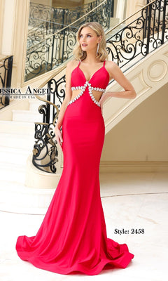 Woman in a bright pink Cut-Out Long Halter Prom Dress (Jessica Angel 2458) with pearl waist details, standing before a decorative staircase.
