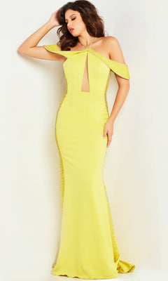 A woman poses in the yellow Jovani Sheer-Illusion-Sides Long Prom Dress 24611, a floor-length designer gown with off-the-shoulder style, front keyhole cutout, and beaded trim—perfect for any formal occasion.