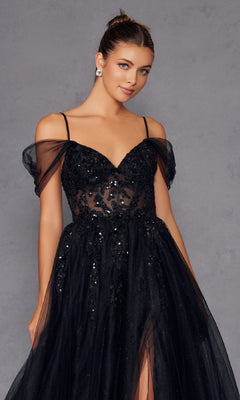 A woman models the Sheer-Waist Long Prom Ball Gown (Juliet JT2466A), a black off-the-shoulder dress with thin straps and sequin details, posing gracefully against a plain gray background.