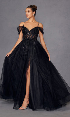 A woman stands against a neutral background wearing the Sheer-Waist Long Prom Ball Gown: Juliet JT2466A, a floor-length, black off-the-shoulder dress with sequin details and a thigh-high slit.