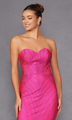 Smiling with eyes closed, a woman wearing the Strapless Long Sequin Prom Dress Juliet JT2472R with black vertical stripes and a sweetheart neckline poses against a plain gray background, accessorized with earrings.