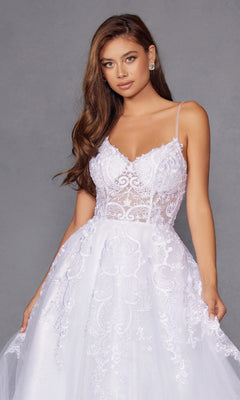 A woman models the Juliet JT2482SW, a long off-white prom dress with a lace bodice, thin straps, and a flowing tulle A-line skirt, standing against a plain gray background.