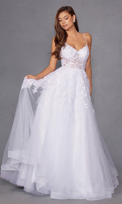 A woman models the Juliet JT2482SW long off-white prom dress with a lace bodice, thin straps, flowing tulle A-line skirt, floral embroidery, and sheer details, standing against a plain gray background.