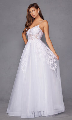 A woman stands against a gray background wearing the Juliet JT2482SW, a long off-white prom dress featuring a lace bodice and flowing tulle A-line skirt.