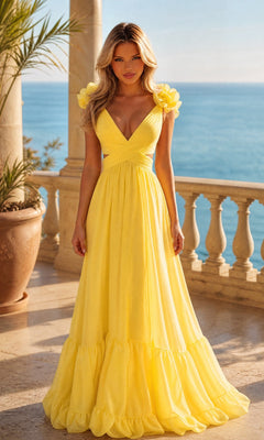 A woman stands on a stone terrace overlooking the sea, wearing a PromGirl Exclusive long light yellow prom dress with ruffle straps.