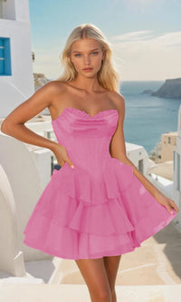 Woman wearing a short bright pink dress with a scenic background