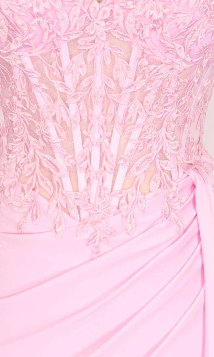 Closeup view of a pink dress with a lace embroidered corset on a mannequin.