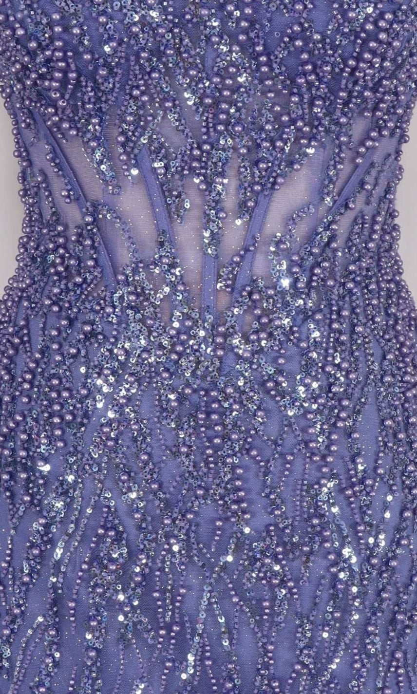 Close-up of a purple beaded dress with intricate patterns