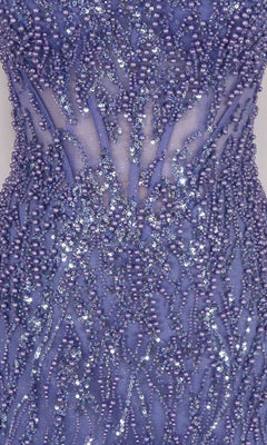 Close-up of a purple beaded dress with intricate patterns