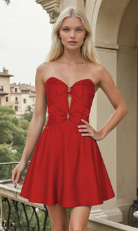Woman wearing a short red strapless dress standing outdoors with buildings in the background