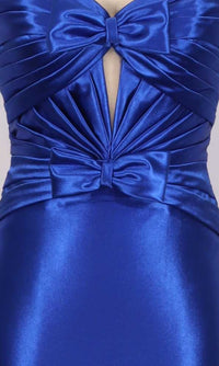 Close-up of a blue satin dress with bow details on a gray background