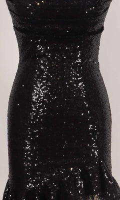 Closeup view of a black sequin dress fabric.